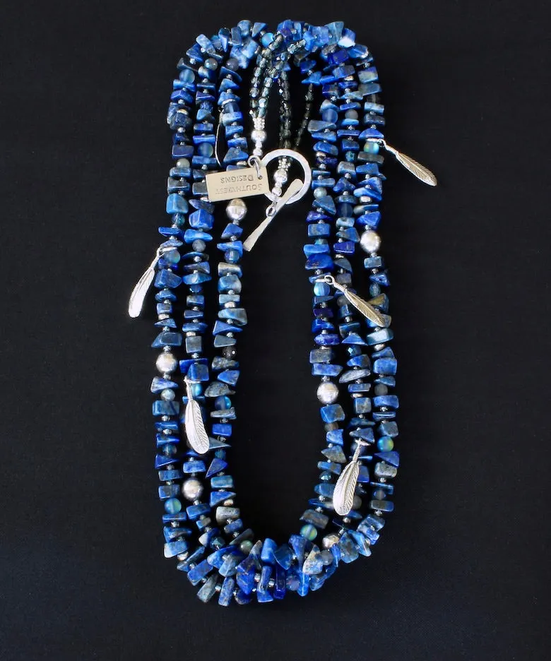 Lapis Lazuli Nugget 3-Strand Necklace with Bench-Made Sterling Silver Rounds, Sterling Silver Feather Charms, Translucent Blue Crystal Rounds, Labradorite Faceted Rounds, Fire Polished Glass, and Hammered Sterling Silver Toggle Clasp